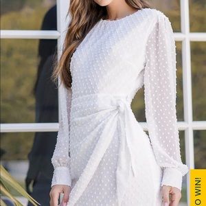 Much love white Swiss dot long sleeve tie dress from Lulu’s